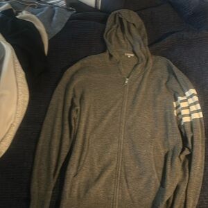 Barely worn zip up grey hoodie with white varsity stripes. Awesome piece.